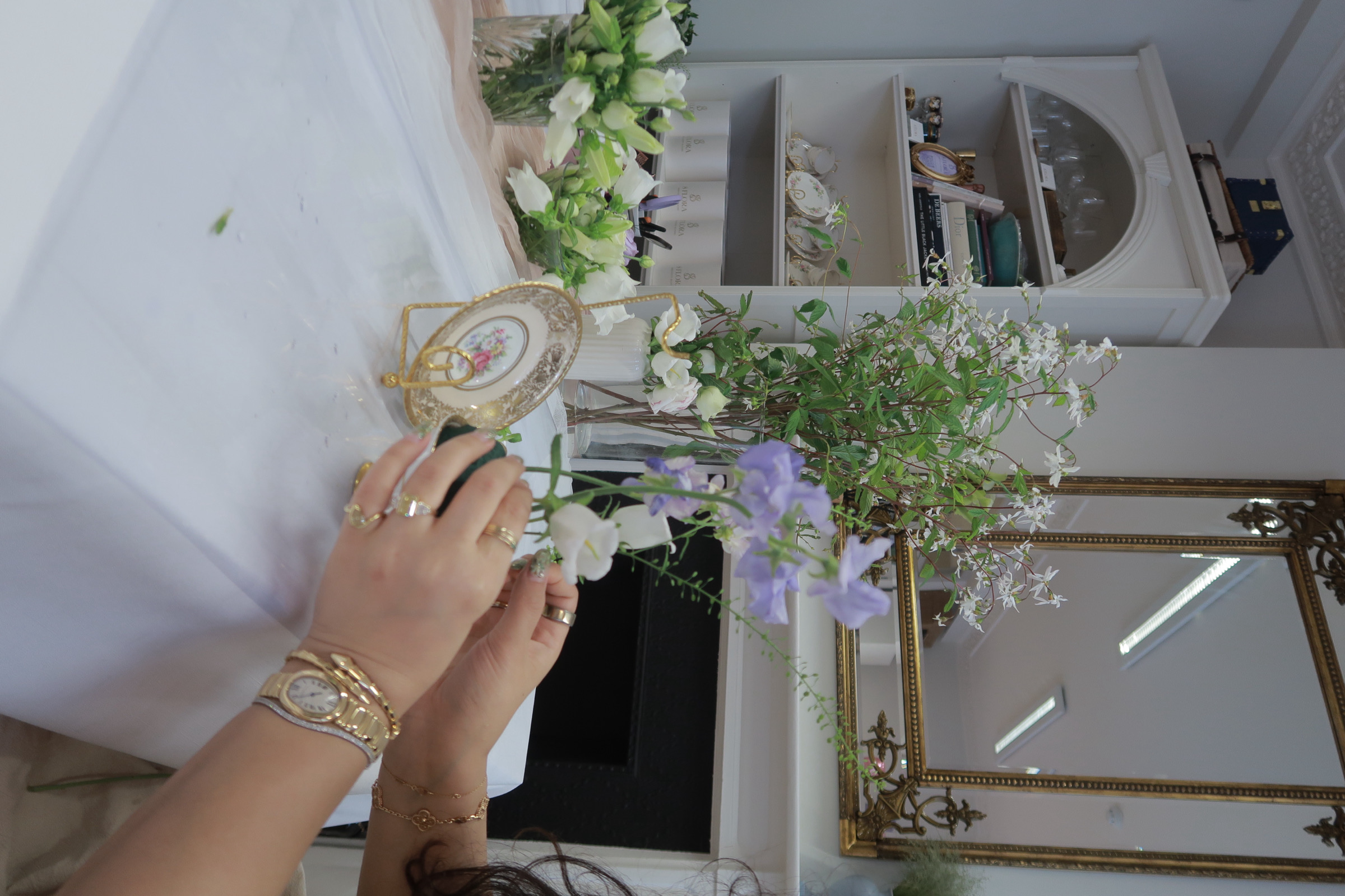 Florist arranging wedding flowers