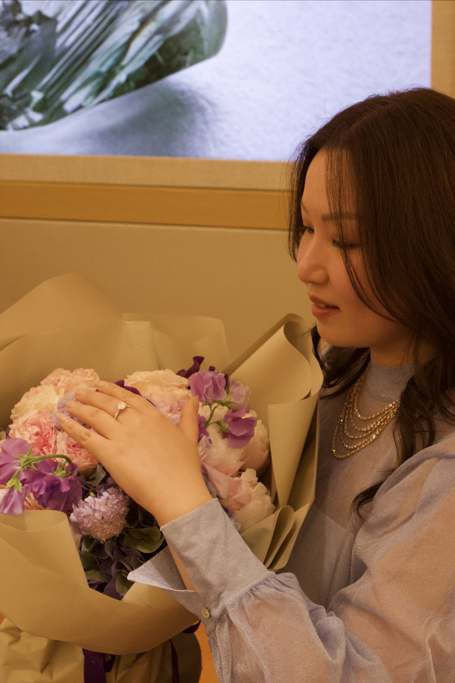 Guest with bouquet at event