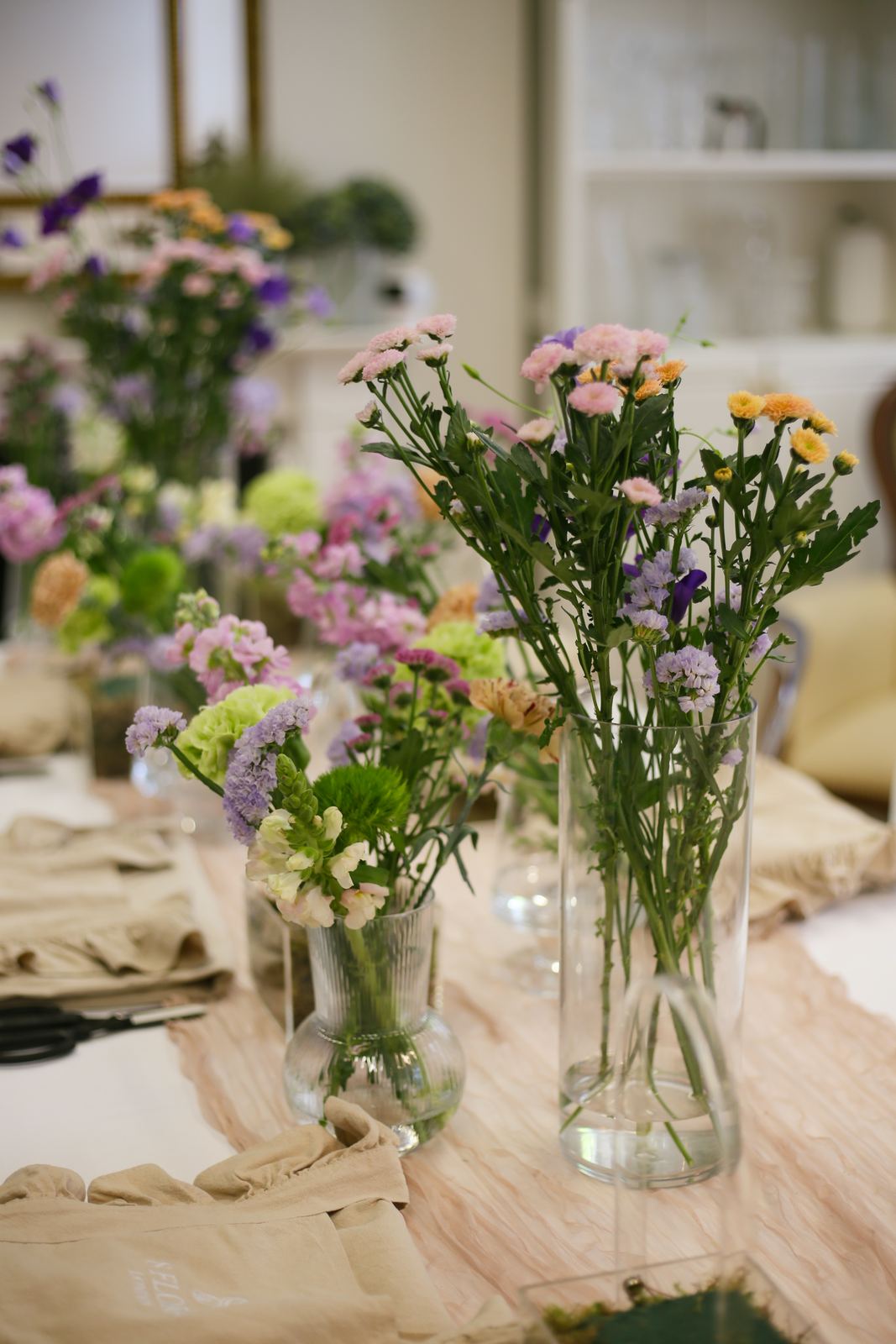 Hands arranging flowers in a workshop