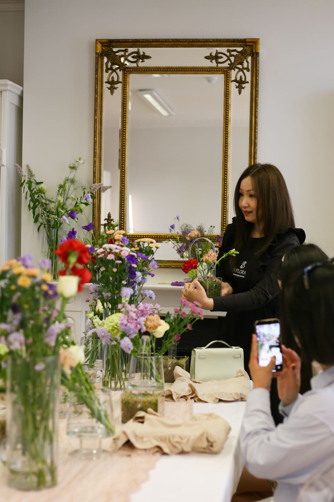 Workshop participants arranging flowers